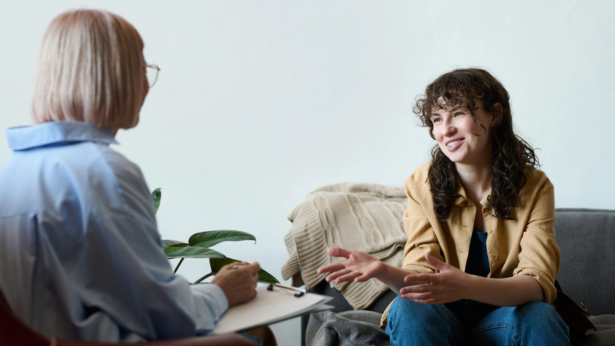 Stock image of someone in discussion with a mental health professional